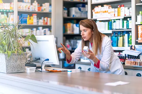 Pharmacist at Computer