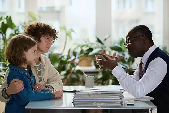 Social Worker talking to a parent and child